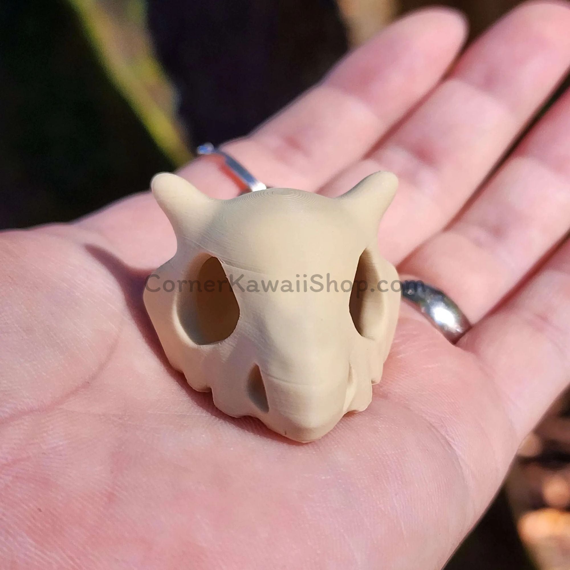3D printed Cubone skull keychain front view
