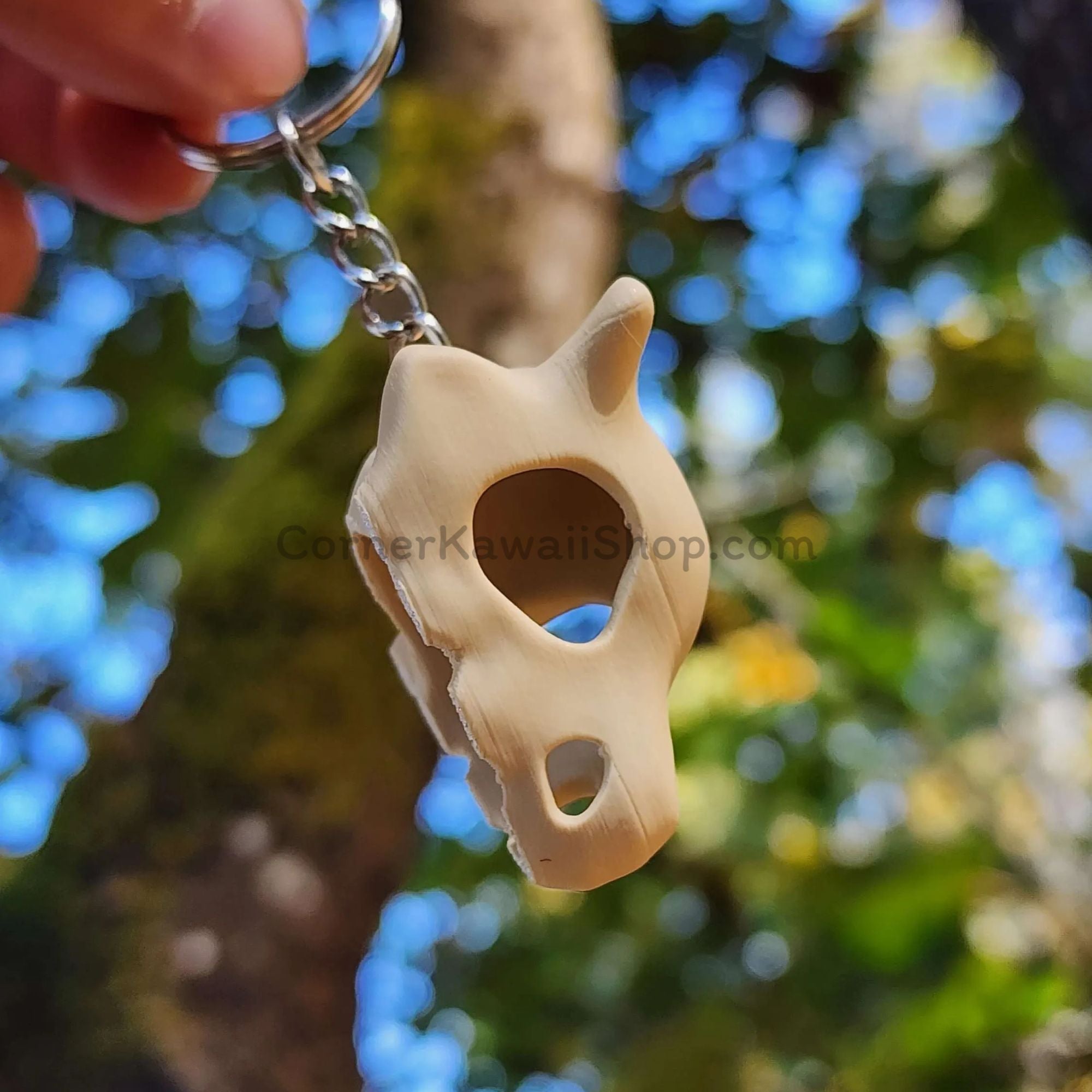 Cubone skull keychain hanging display