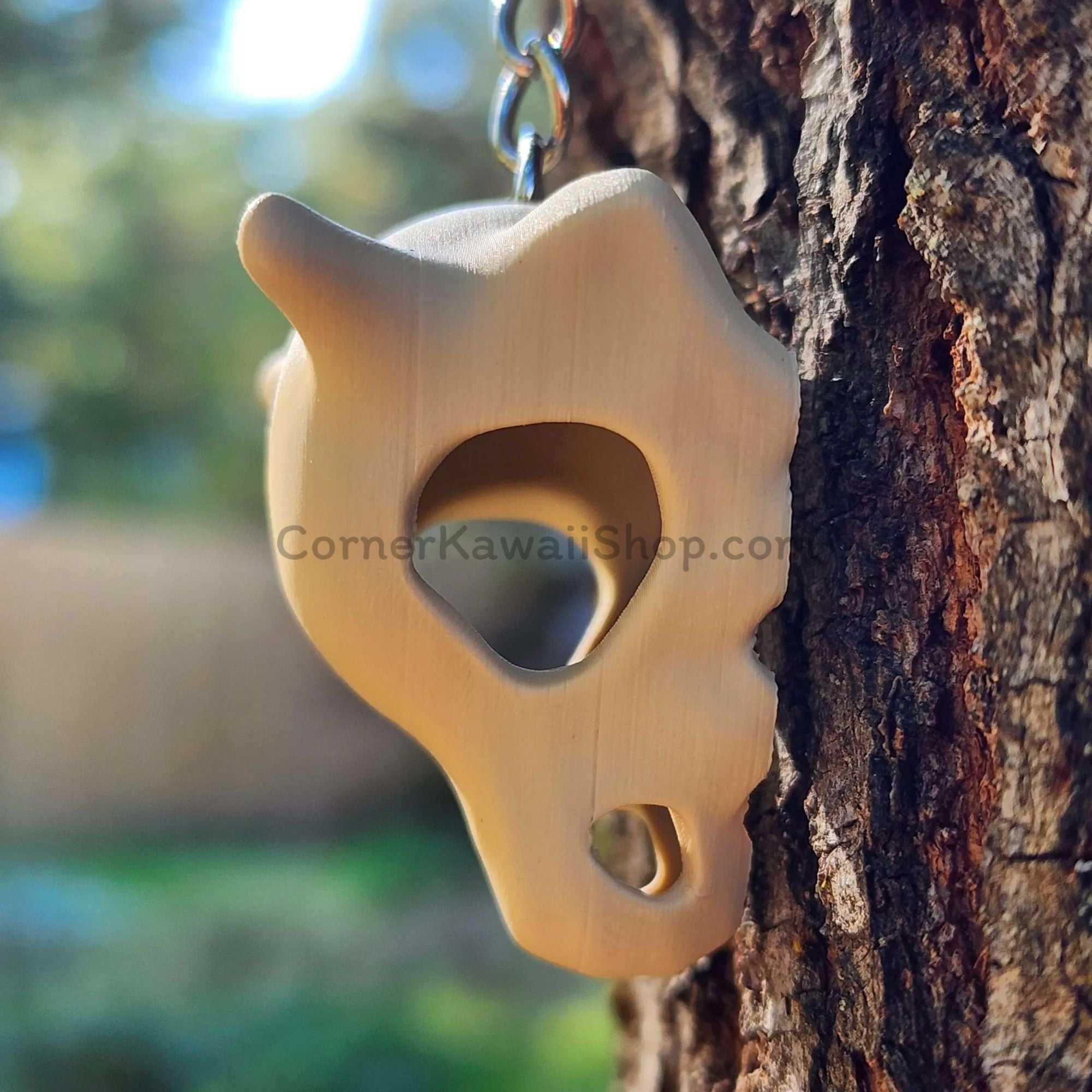Cubone skull keychain side profile close-up