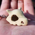 Cubone skull keychain size comparison with hand